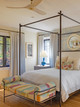 Bench at end of bed upholstered in Span Ecru in a fun, patterned bedroom by JNR Design. Photography by Kyle Caldwell.